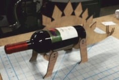 CNC Laser Cut Stegosaurus Shaped Wine Bottle Holder CDR File